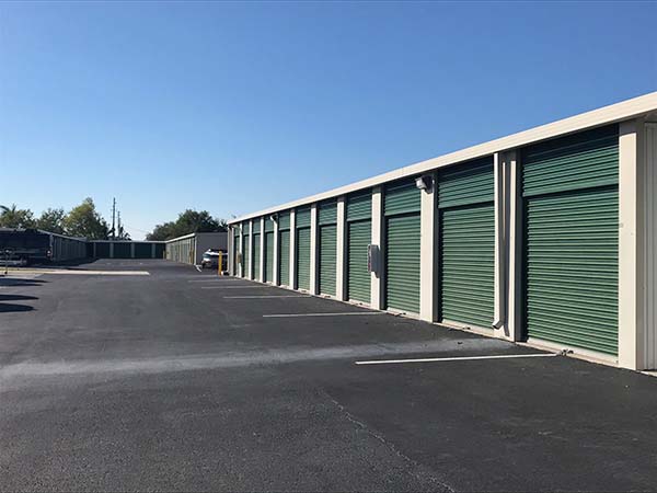 Outdoor storage units with drive-up access at Compass Self Storage.