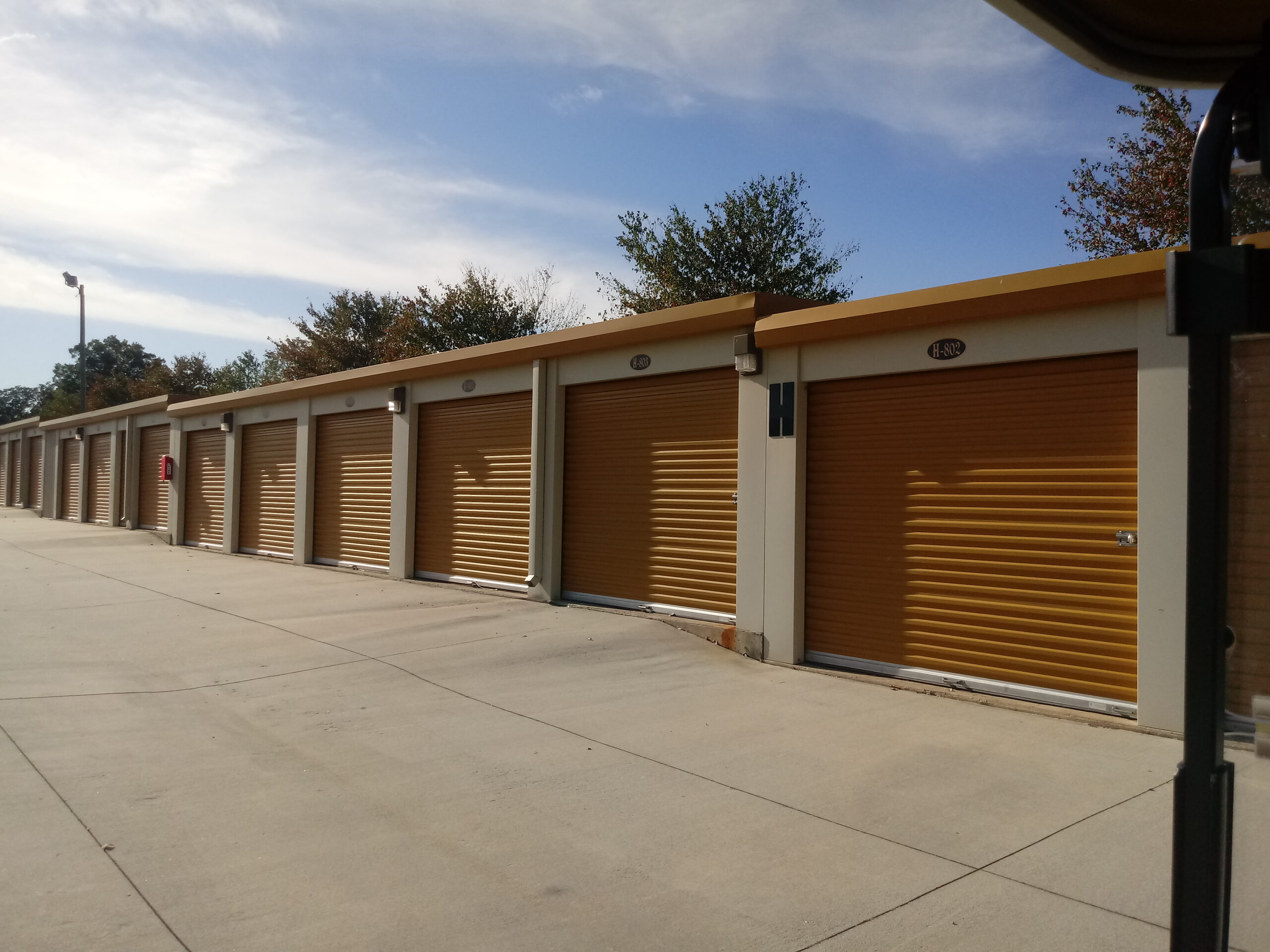 Outdoor storage units with drive-up access at Compass Self Storage.