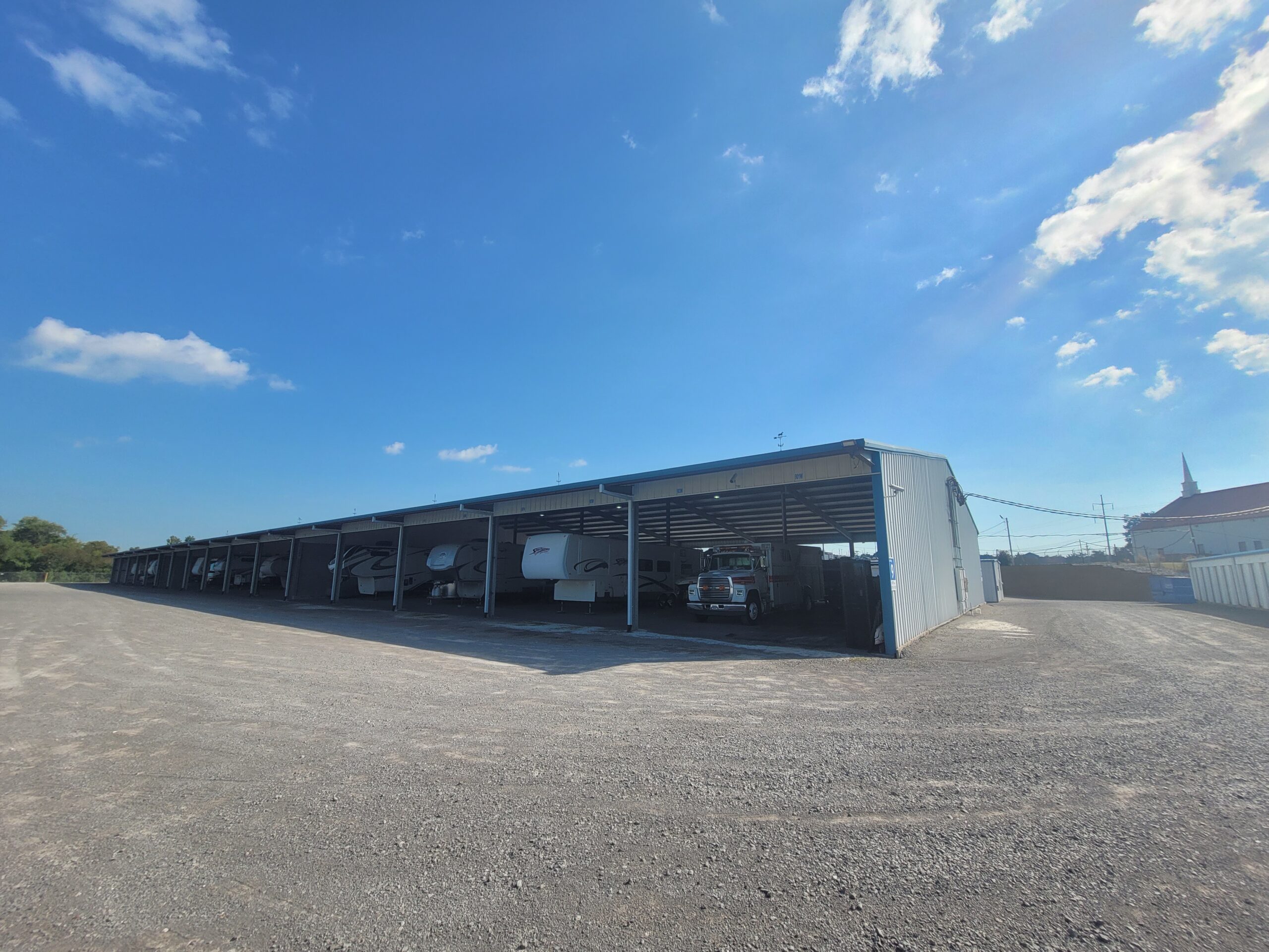 Covered RV parking at Compass Self Storage.
