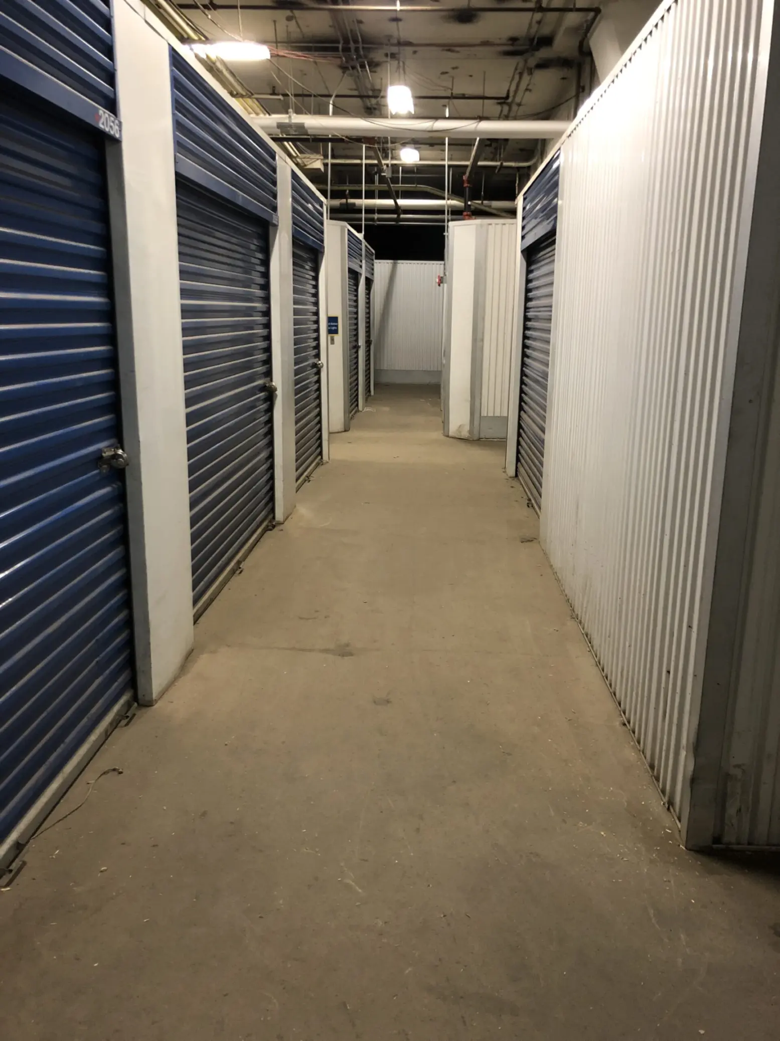 Indoor storage units with blue doors.