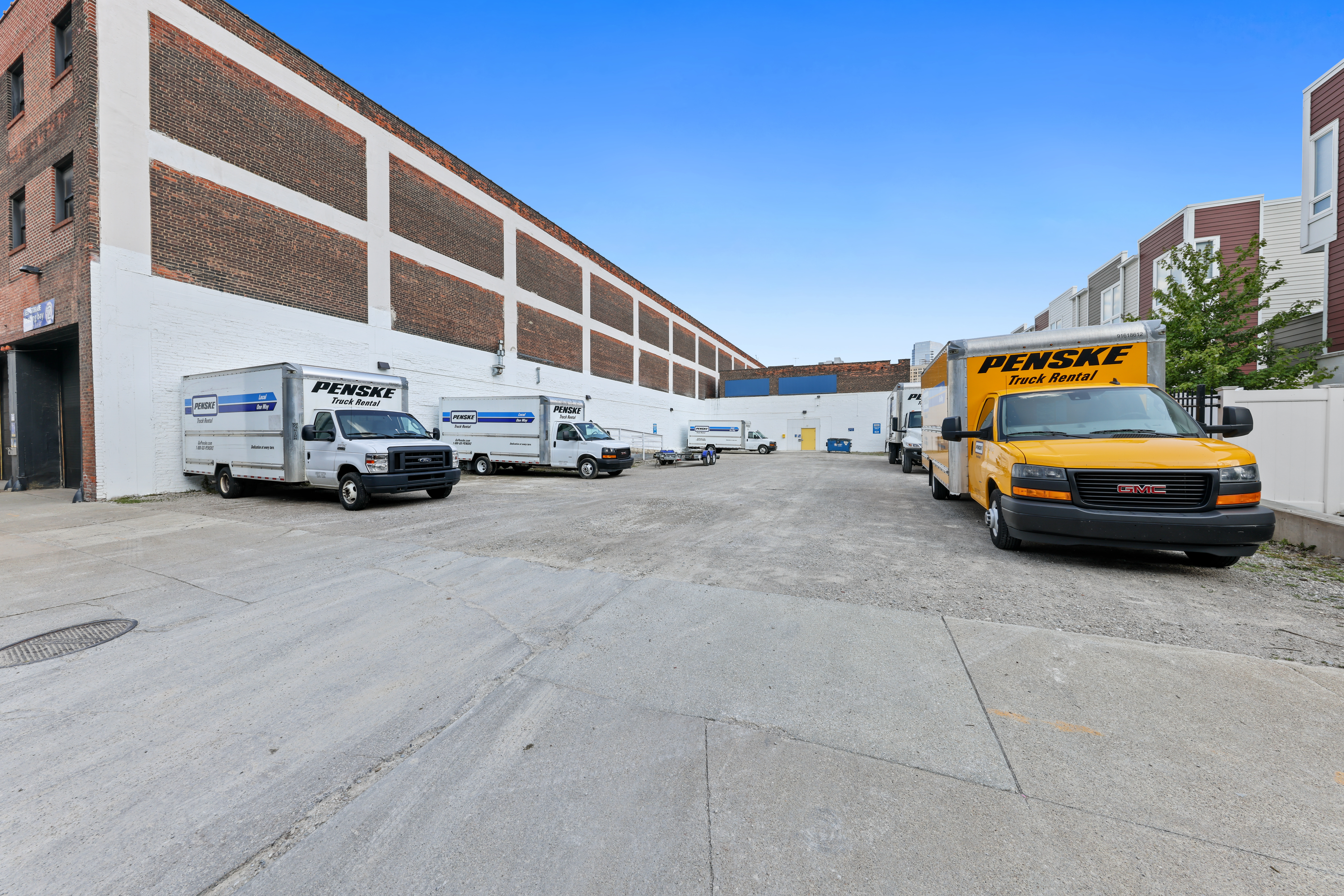 Moving trucks at Compass Self Storage.