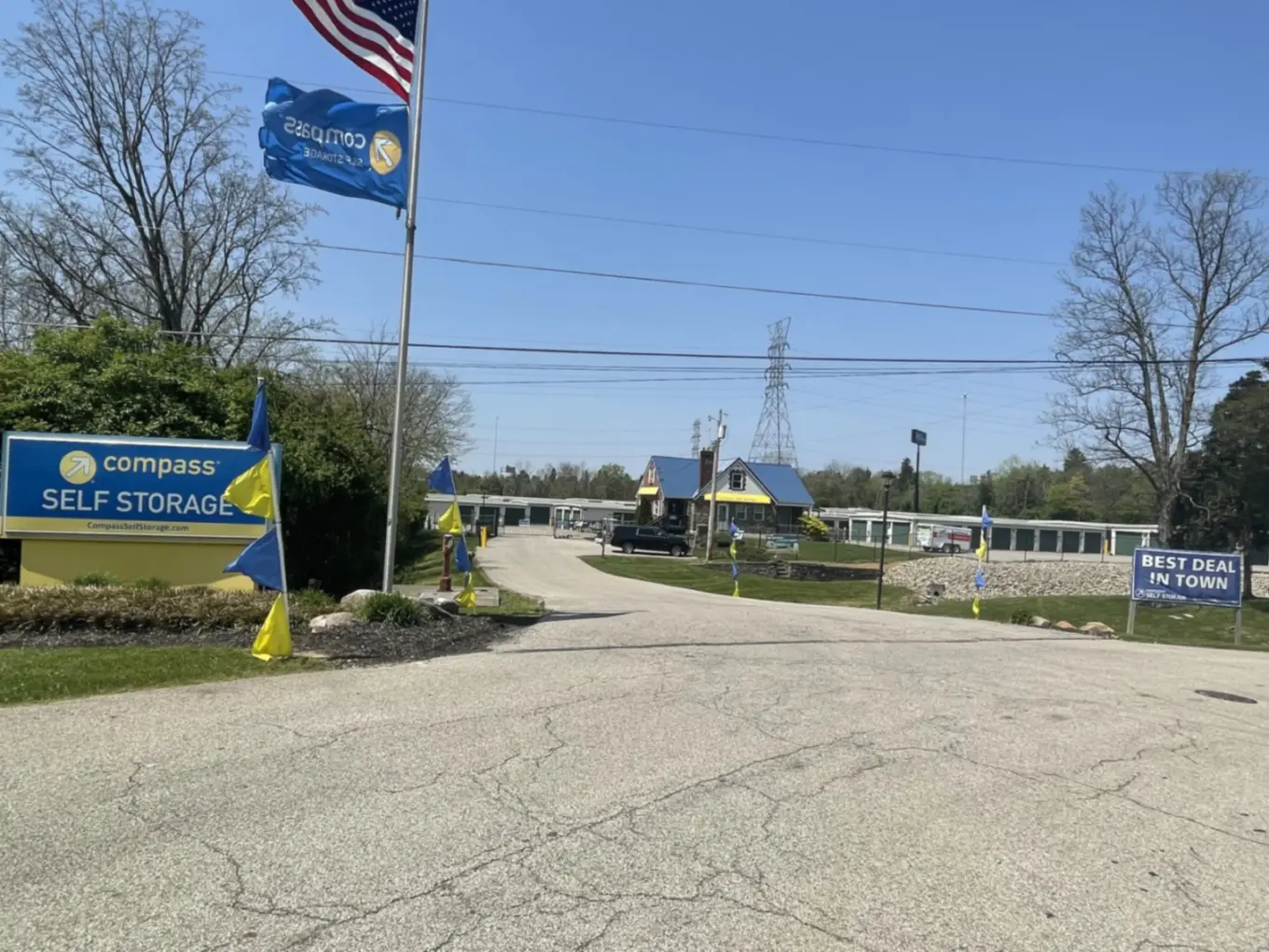 Entrance with large sign at Compass Self Storage.