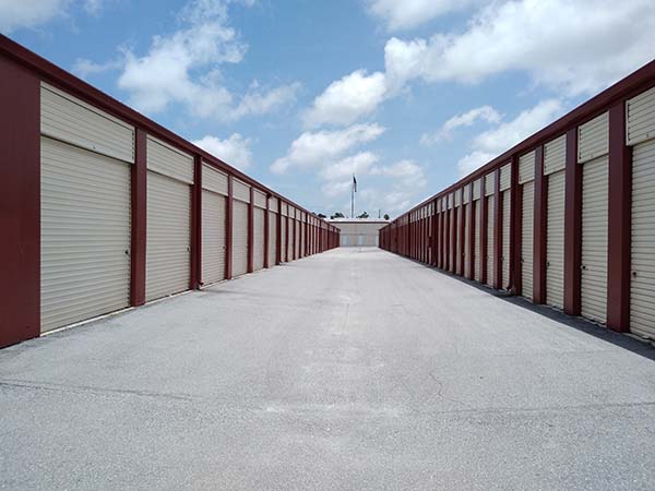 Compass Self Storage drive-up storage units with red trim.