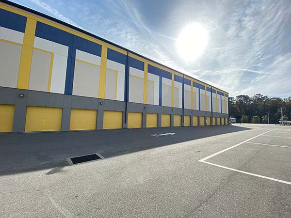 Drive-up outdoor storage units on the back of the facility building.