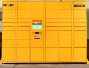 a big yellow Amazon Locker with multiple locker spaces for packages