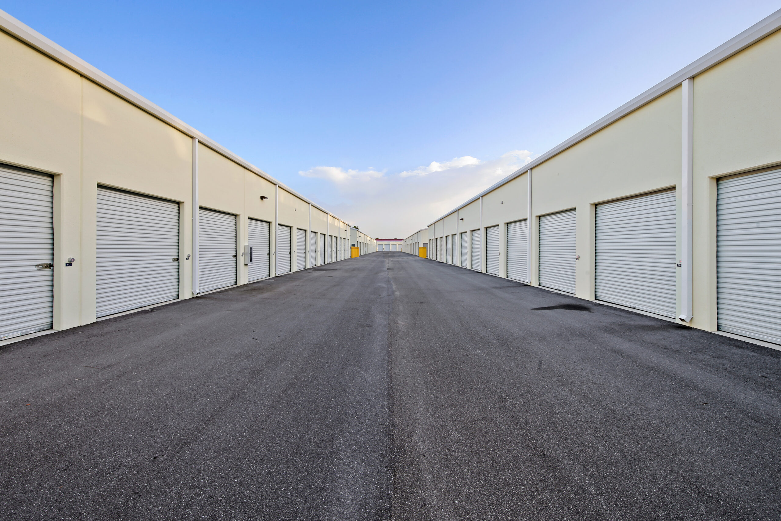 Drive-up storage units on a paved road.