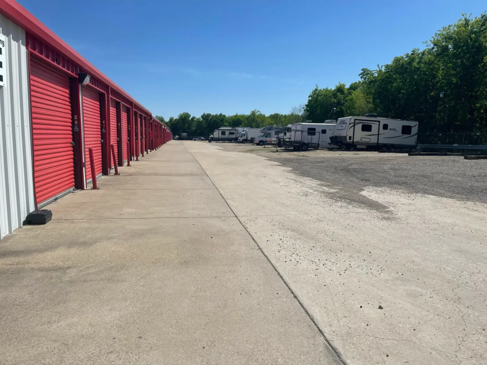Outdoor storage units with uncovered RV parking.