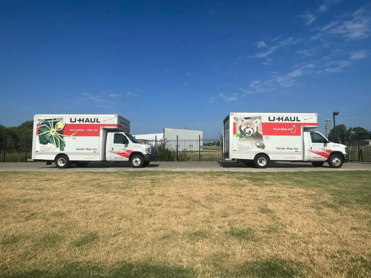 Two U-Haul box trucks.