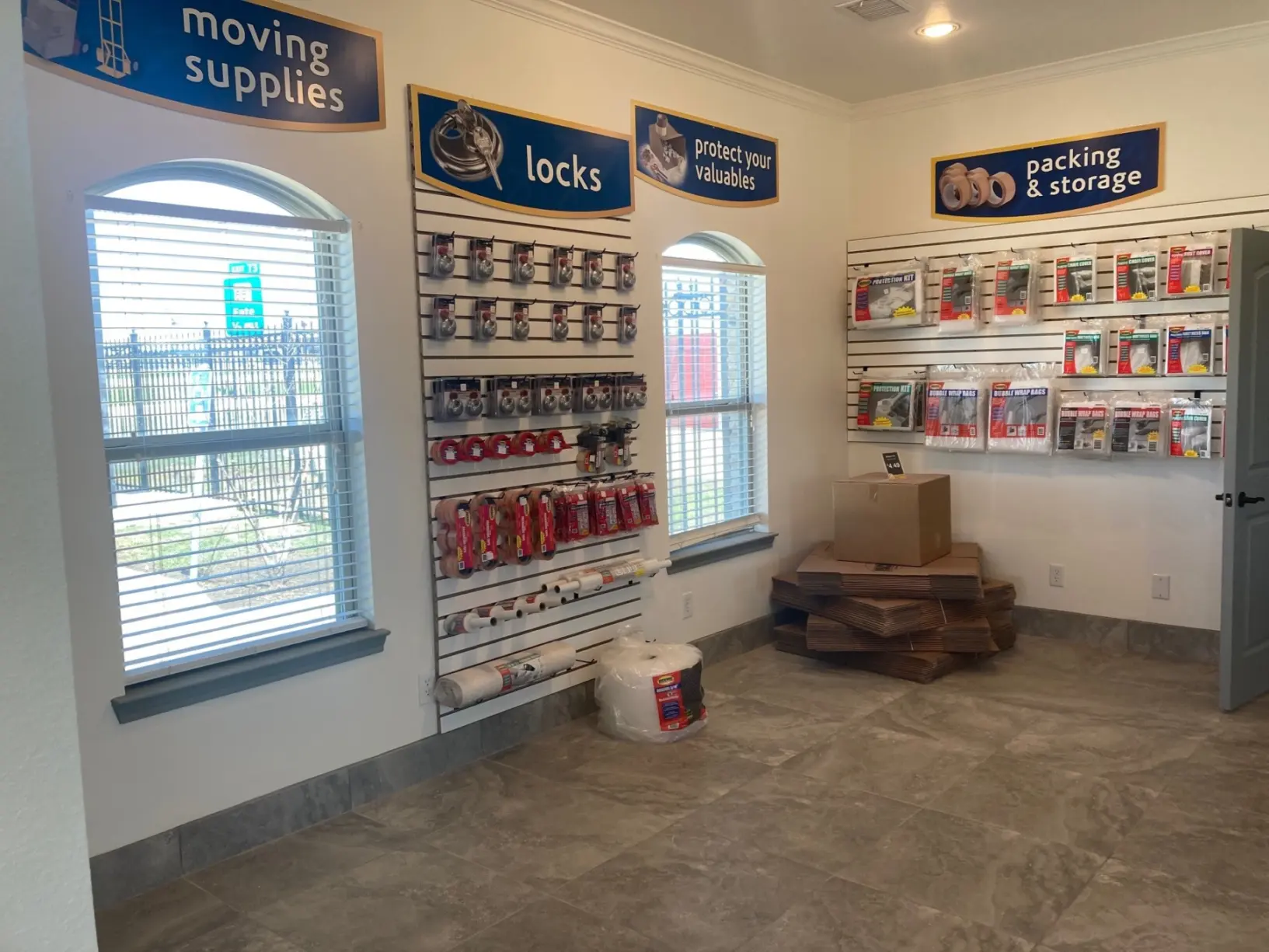 Moving supplies for sale in carts with an Amazon pickup box.