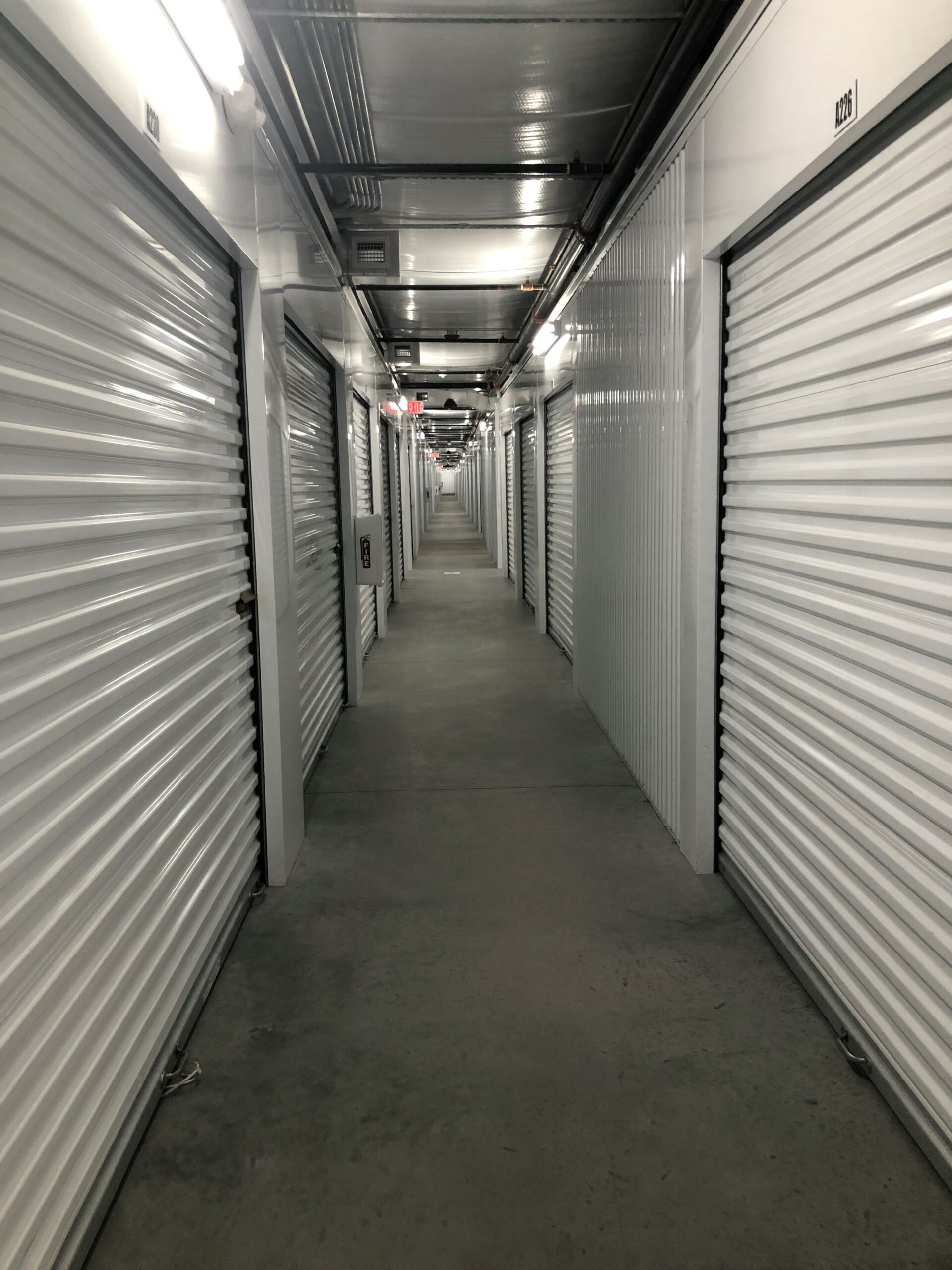 Hallway with indoor storage units.