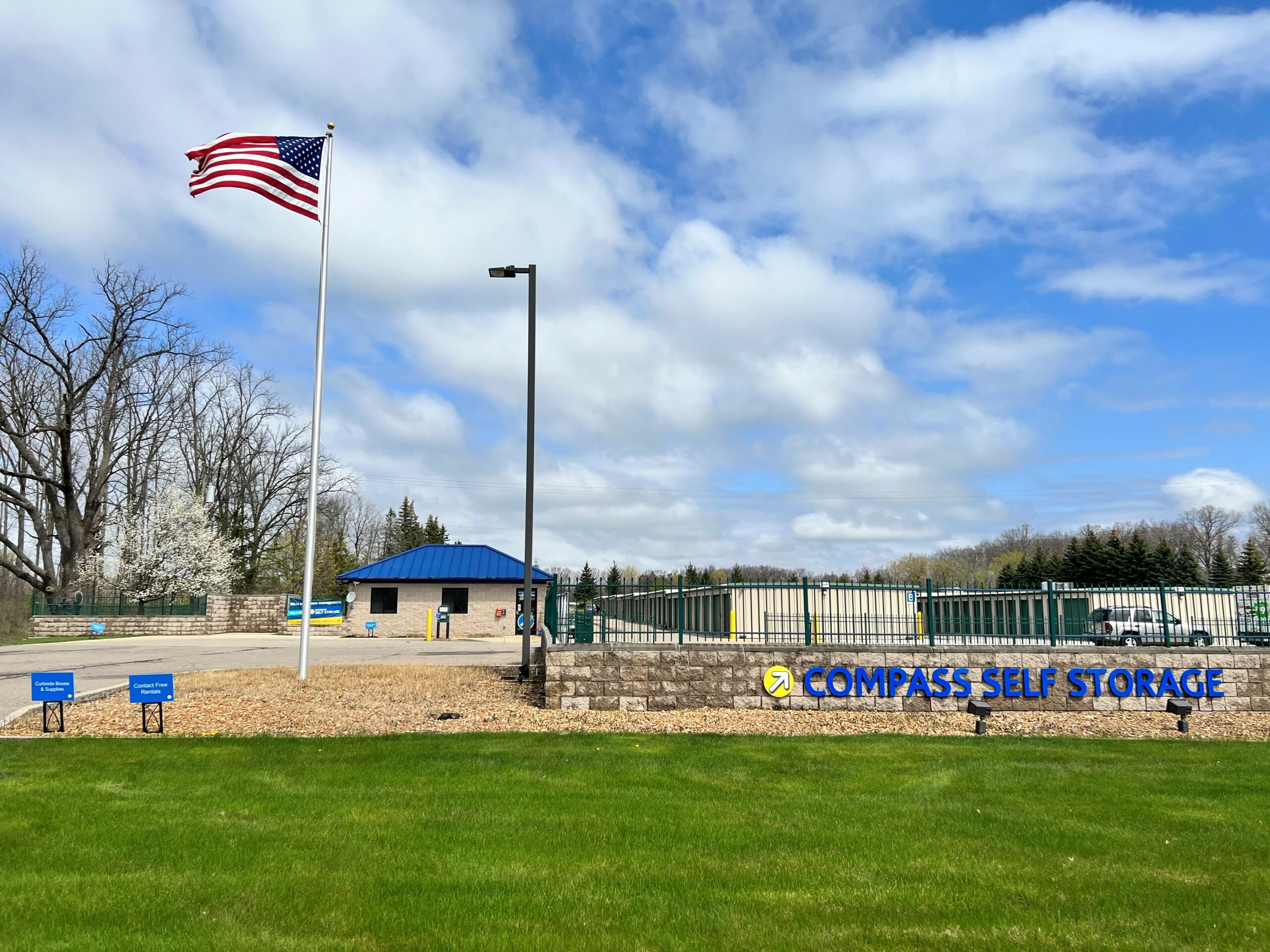Facility signage at Compass Self Storage.