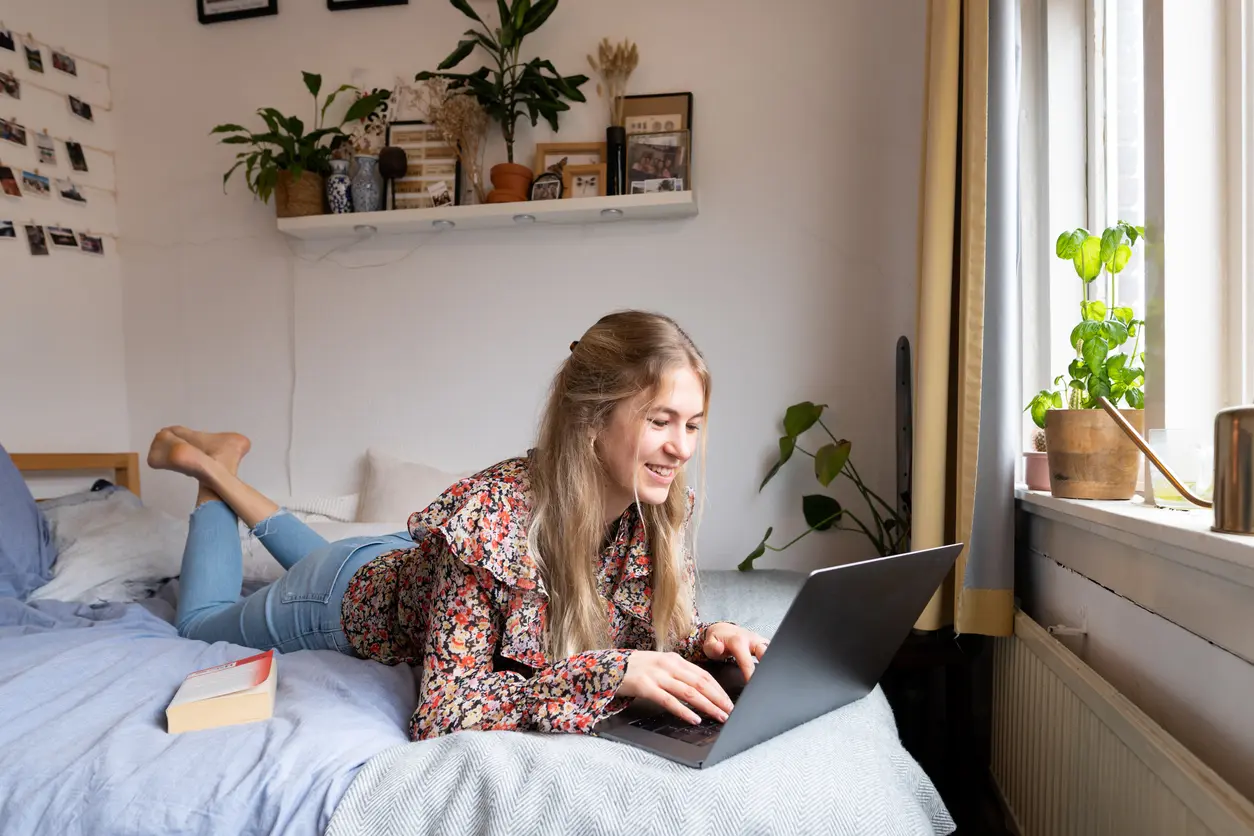 A university student in her own dorm room.